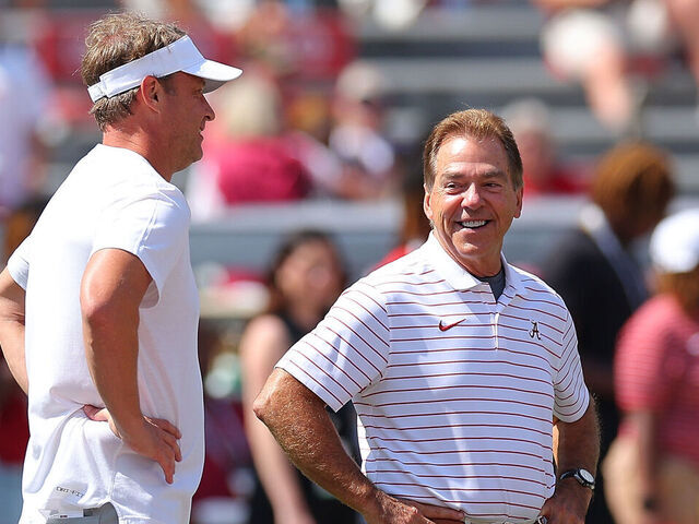 TUSCALOOSA, ALABAMA - SEPTEMBER 23: Head coach Nick Saban of the Alabama Crimson Tide and head coach Lane Kiffin of the Mississippi Rebels converse prior to their game at Bryant-Denny Stadium on September 23, 2023 in Tuscaloosa, Alabama.