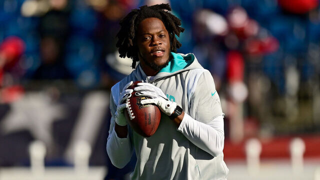 FOXBOROUGH, MASSACHUSETTS - JANUARY 01: Teddy Bridgewater #5 of the Miami Dolphins warms up against the New England Patriots at Gillette Stadium on January 01, 2023 in Foxborough, Massachusetts.