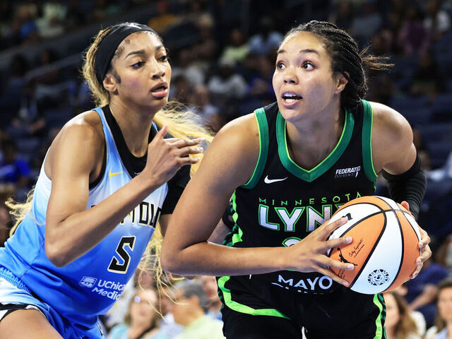 CHICAGO, ILLINOIS - JULY 14: Napheesa Collier #24 of the Minnesota Lynx battles with Angel Reese #5 of the Chicago Sky during the fourth quarter at Wintrust Arena on July 14, 2025 in Chicago, Illinois.