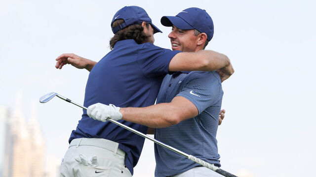 DUBAI, UNITED ARAB EMIRATES - JANUARY 13: Rory McIlroy of Northern Ireland hugs Tommy Fleetwood of England on the practice range prior to the Hero Dubai Desert Classic at Emirates Golf Club on January 13, 2025 in Dubai, United Arab Emirates.