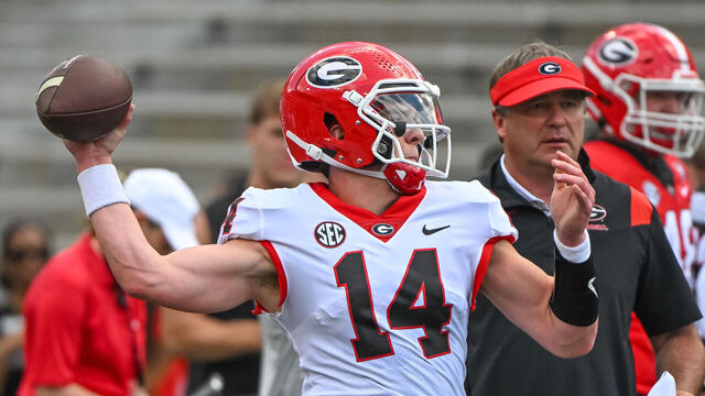 ATHENS, GA - APRIL 15: Georgia Bulldogs R-Fr. QB Gunner Stockton (14) with Georgia Bulldogs Head Coach Kirby Smart watching closely during the G-Day Red and Black Spring Game on April 15, 2023, at Sanford Stadium in Athens, GA.