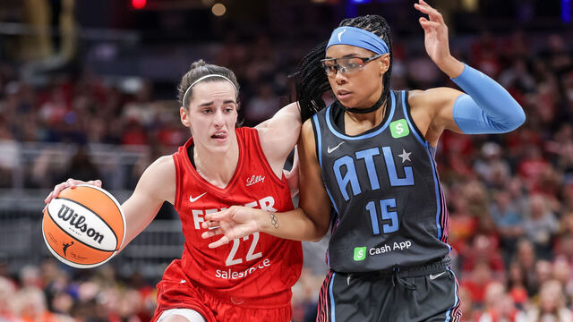 INDIANAPOLIS, INDIANA - JULY 11: Caitlin Clark #22 of the Indiana Fever dribbles the ball against Allisha Gray #15 of the Atlanta Dream at Gainbridge Fieldhouse on July 11, 2025 in Indianapolis, Indiana.