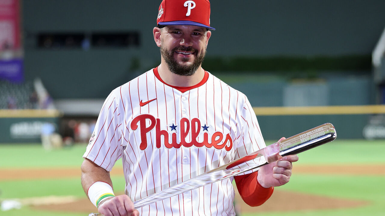 ATLANTA, GEORGIA - JULY 15: Kyle Schwarber #12 of the Philadelphia Phillies celebrates after winning the Most Valuable Player of the MLB All-Star Game at Truist Park on July 15, 2025 in Atlanta, Georgia.