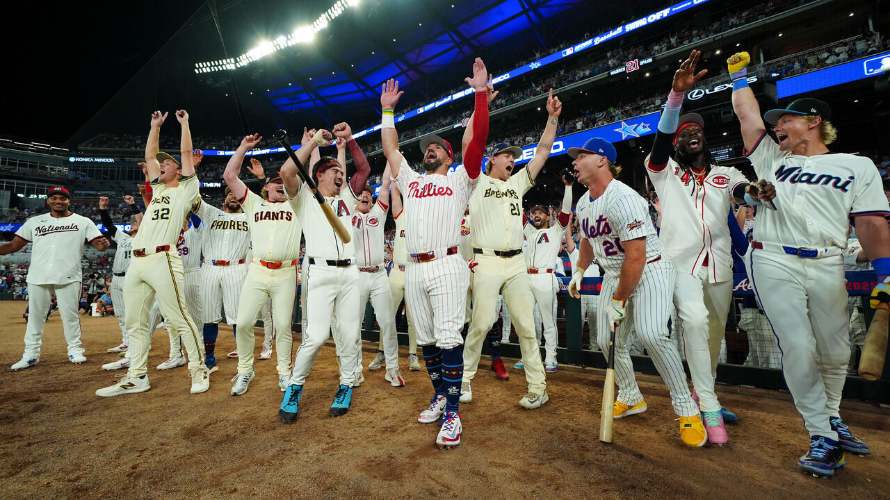 ATLANTA, GA - JULY 15: Kyle Schwarber #12 of the Philadelphia Phillies celebrates with teammates after hitting three home runs in three swings to win the Inaugural All-Star Game Swingoff Presented by Geico and win the 95th MLB All-Star Game presented by Mastercard at Truist Park on Tuesday, July 15, 2025 in Atlanta, Georgia.