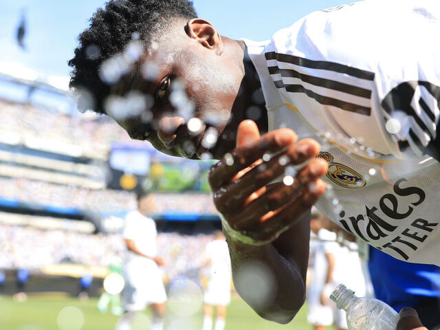 EAST RUTHERFORD, NEW JERSEY - JULY 05: Aurelien Tchouameni #14 of Real Madrid C.F. splashes water prior to the FIFA Club World Cup 2025 quarter-final match between Real Madrid CF and Borussia Dortmund at MetLife Stadium on July 05, 2025 in East Rutherford, New Jersey.