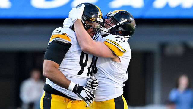 CHARLOTTE, NORTH CAROLINA - DECEMBER 18: Cameron Heyward #97 of the Pittsburgh Steelers celebrates with T.J. Watt #90 after a sack against Sam Darnold #14 of the Carolina Panthers during the third quarter of the game at Bank of America Stadium on December 18, 2022 in Charlotte, North Carolina.
