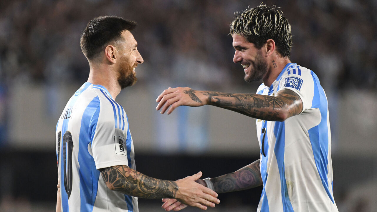 Lionel Messi and Rodrigo de Paul of Argentina celebrate their team's first goal during a match between Argentina and Bolivia at Estadio Mas Monumental Antonio Vespucio Liberti in Buenos Aires, Argentina, on October 15.