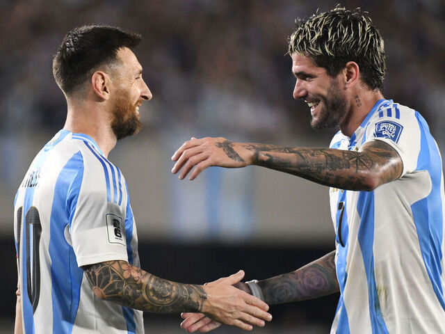 Lionel Messi and Rodrigo de Paul of Argentina celebrate their team's first goal during a match between Argentina and Bolivia at Estadio Mas Monumental Antonio Vespucio Liberti in Buenos Aires, Argentina, on October 15.