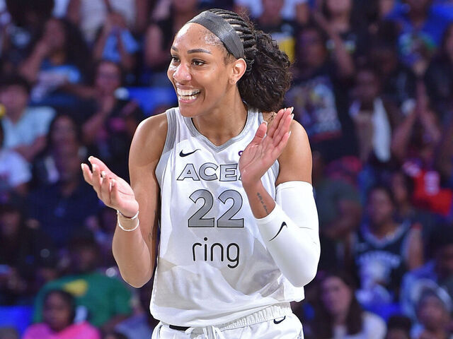 ARLINGTON, TX - JULY 16: A'ja Wilson #22 of the Las Vegas Aces celebrates during the game against the Dallas Wings on July 16, 2025 at the College Park Center in Arlington, TX. Mandatory Copyright Notice: Copyright 2025 NBAE