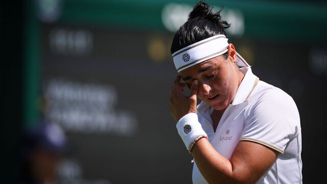 Tunisia's Ons Jabeur reacts as she plays against Bulgaria's Viktoriya Tomova during their women's singles first round tennis match on the first day of the 2025 Wimbledon Championships at The All England Lawn Tennis and Croquet Club in Wimbledon, southwest London, on June 30, 2025.