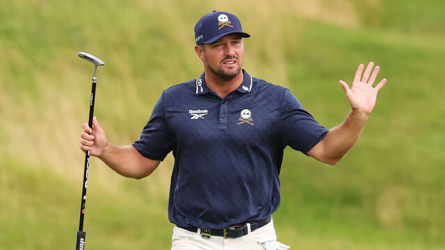 PORTRUSH, NORTHERN IRELAND - JULY 18: Bryson DeChambeau of the United States acknowledges the crowd on the 18th green during day two of The 153rd Open Championship at Royal Portrush Golf Club on July 18, 2025 in Portrush, Northern Ireland.
