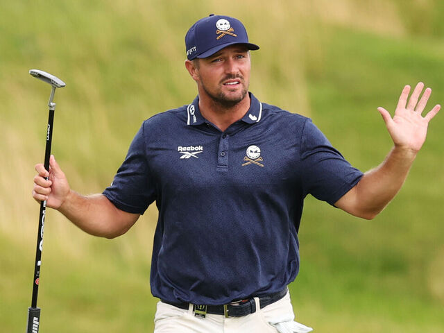 PORTRUSH, NORTHERN IRELAND - JULY 18: Bryson DeChambeau of the United States acknowledges the crowd on the 18th green during day two of The 153rd Open Championship at Royal Portrush Golf Club on July 18, 2025 in Portrush, Northern Ireland.