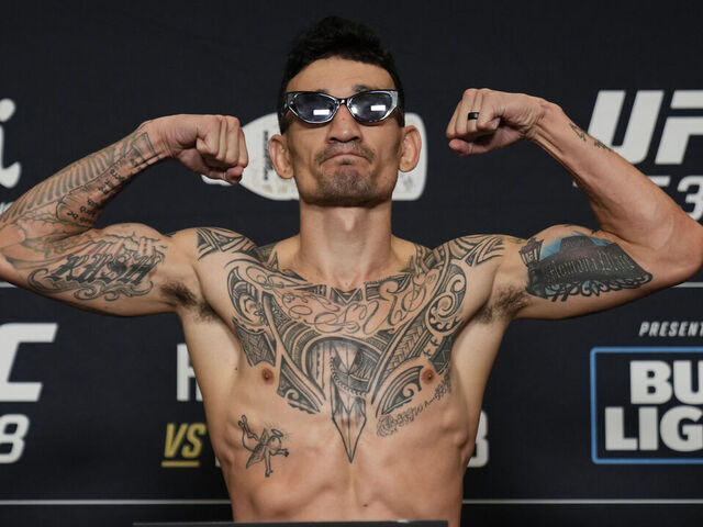 NEW ORLEANS, LOUISIANA - JULY 18: Max Holloway poses on the scale during the UFC 318 official weigh-in at the Royal Sonesta New Orleans on July 18, 2025 in New Orleans, Louisiana.