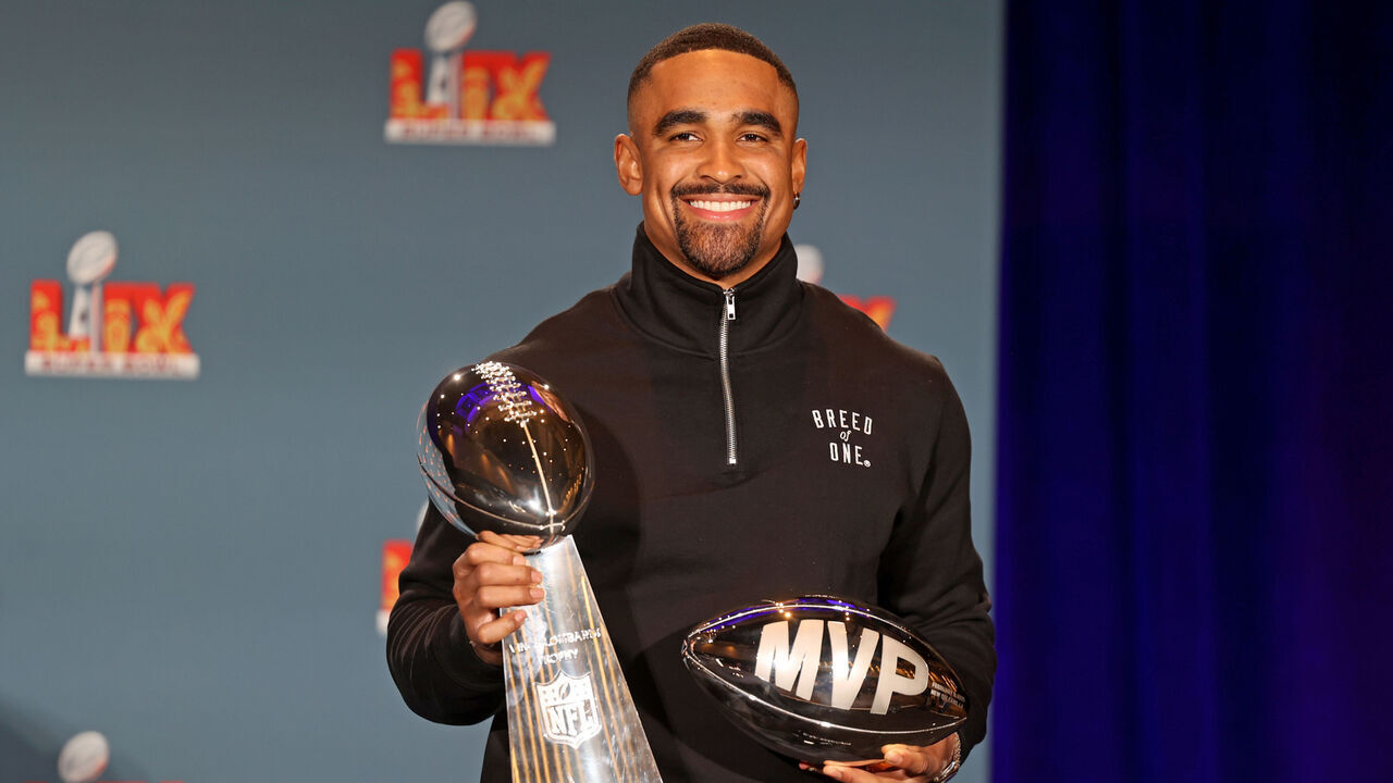 NEW ORLEANS, LOUISIANA - FEBRUARY 10: Quarterback Jalen Hurts #1 of the Philadelphia Eagles, the MVP of Super Bowl LIX, holds both the MVP and Vince Lombardi trophies during a press conference at the Ernest N. Morial Convention Center on February 10, 2025 in New Orleans, Louisiana. The Eagles defeated the Kansas City Chiefs 40-22 in the Caesars Superdome on Sunday night.