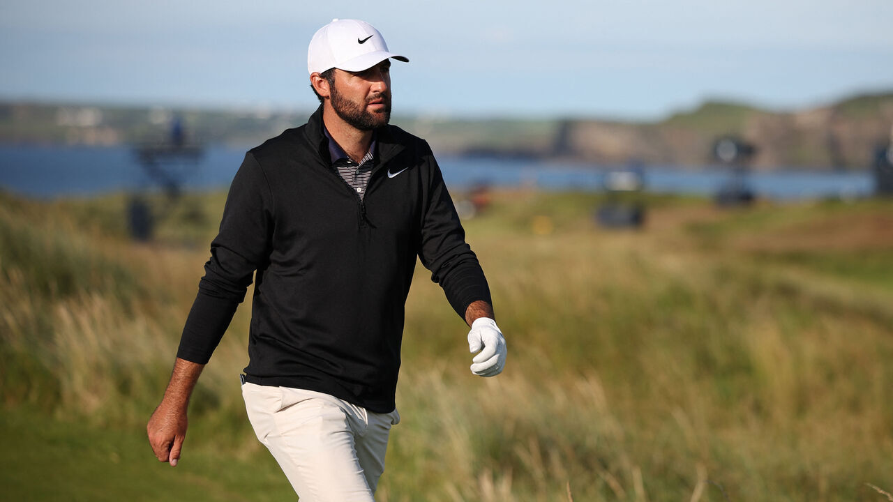 US golfer Scottie Scheffler walks up the 17th fairway on day three of the 153rd Open Championship at Royal Portrush golf club in Northern Ireland on July 19, 2025.