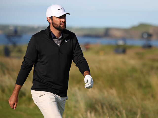 US golfer Scottie Scheffler walks up the 17th fairway on day three of the 153rd Open Championship at Royal Portrush golf club in Northern Ireland on July 19, 2025.
