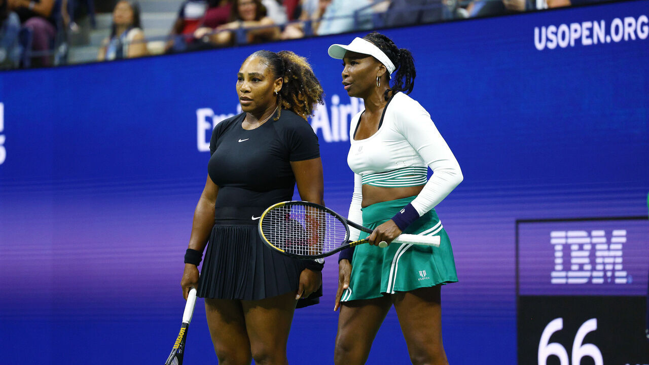 NEW YORK, NEW YORK - SEPTEMBER 01: Serena Williams and Venus Williams of The United States confer against Lucie Hradecka and Linda Noskova of Czech Republic during the Women's Doubles First Round match on Day Four of the 2022 US Open at USTA Billie Jean King National Tennis Center on September 01, 2022 in the Flushing neighborhood of the Queens borough of New York City.