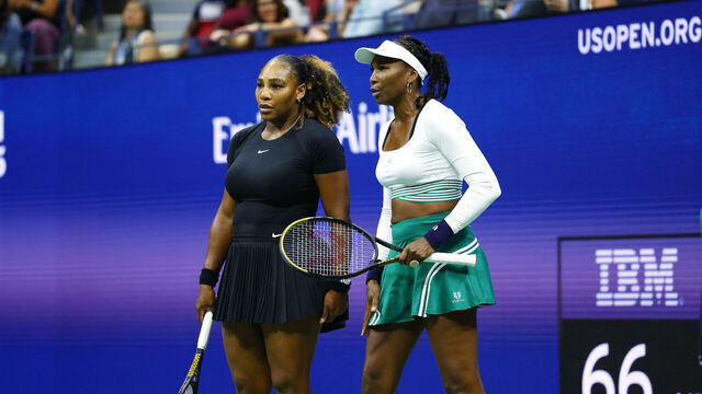 NEW YORK, NEW YORK - SEPTEMBER 01: Serena Williams and Venus Williams of The United States confer against Lucie Hradecka and Linda Noskova of Czech Republic during the Women's Doubles First Round match on Day Four of the 2022 US Open at USTA Billie Jean King National Tennis Center on September 01, 2022 in the Flushing neighborhood of the Queens borough of New York City.
