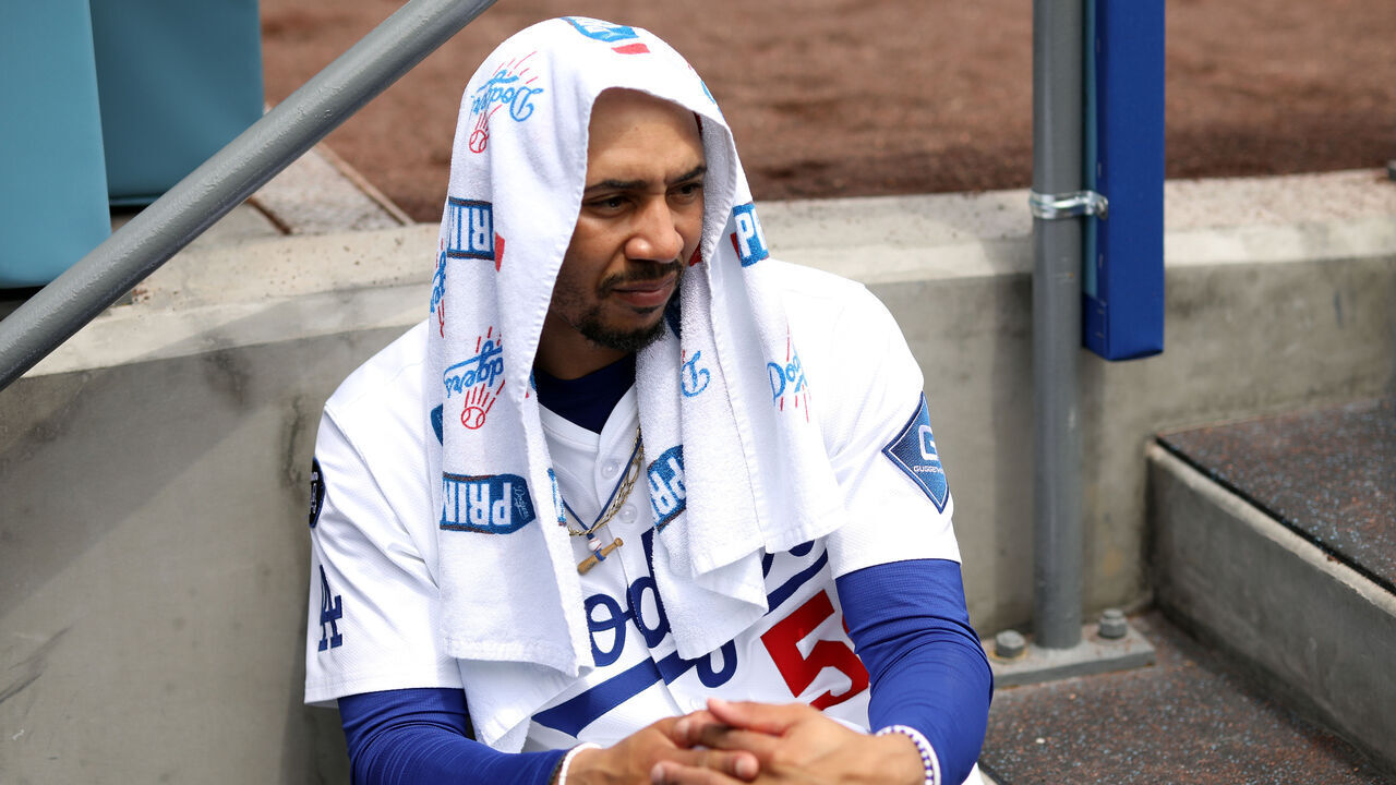 LOS ANGELES, CALIFORNIA - APRIL 30: Mookie Betts #50 of the Los Angeles Dodgers looks on from the dugout during the second inning against the Miami Marlins at Dodger Stadium on April 30, 2025 in Los Angeles, California.