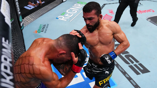 NEW ORLEANS, LOUISIANA - JULY 19: Patricio 'Pitbull' Freire of Brazil punches Dan Ige in a featherweight bout during the UFC 318 event at Smoothie King Center on July 19, 2025 in New Orleans, Louisiana.