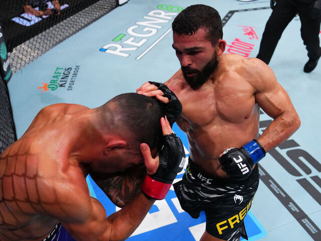NEW ORLEANS, LOUISIANA - JULY 19: Patricio 'Pitbull' Freire of Brazil punches Dan Ige in a featherweight bout during the UFC 318 event at Smoothie King Center on July 19, 2025 in New Orleans, Louisiana.