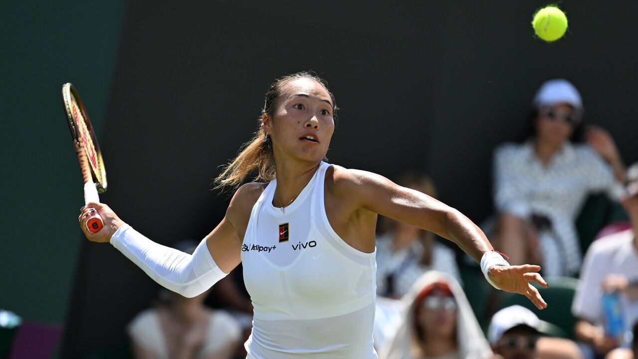 Zheng Qinwen hits a return during the women's singles first round match between Zheng Qinwen of China and Katerina Siniakova of the Czech Republic at the Wimbledon Tennis Championships in London, Britain, July 1, 2025.