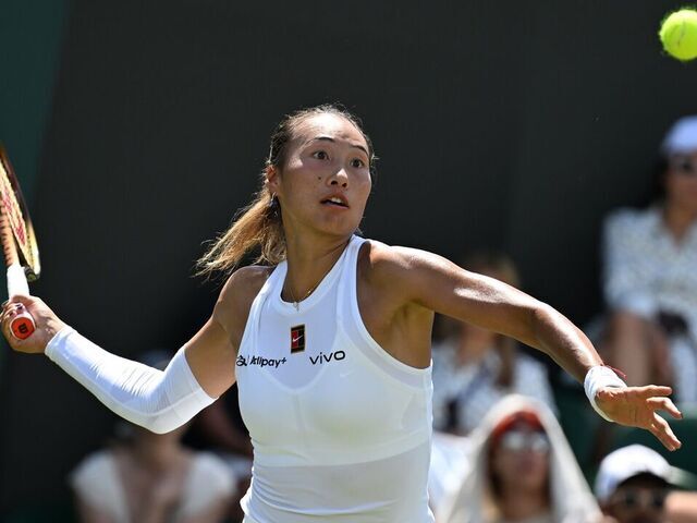 Zheng Qinwen hits a return during the women's singles first round match between Zheng Qinwen of China and Katerina Siniakova of the Czech Republic at the Wimbledon Tennis Championships in London, Britain, July 1, 2025.
