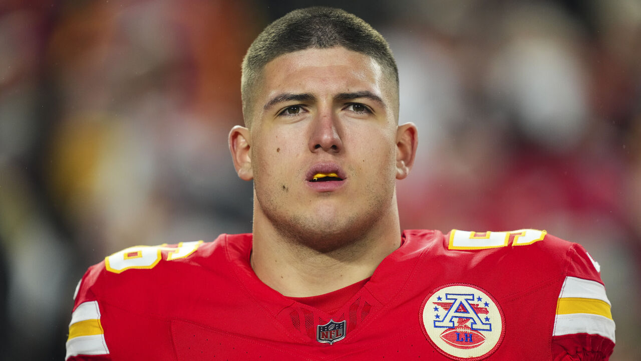 KANSAS CITY, MO - DECEMBER 08: George Karlaftis #56 of the Kansas City Chiefs looks on from the sideline prior to an NFL football game against the Los Angeles Chargers at GEHA Field at Arrowhead Stadium on December 8, 2024 in Kansas City, Missouri.