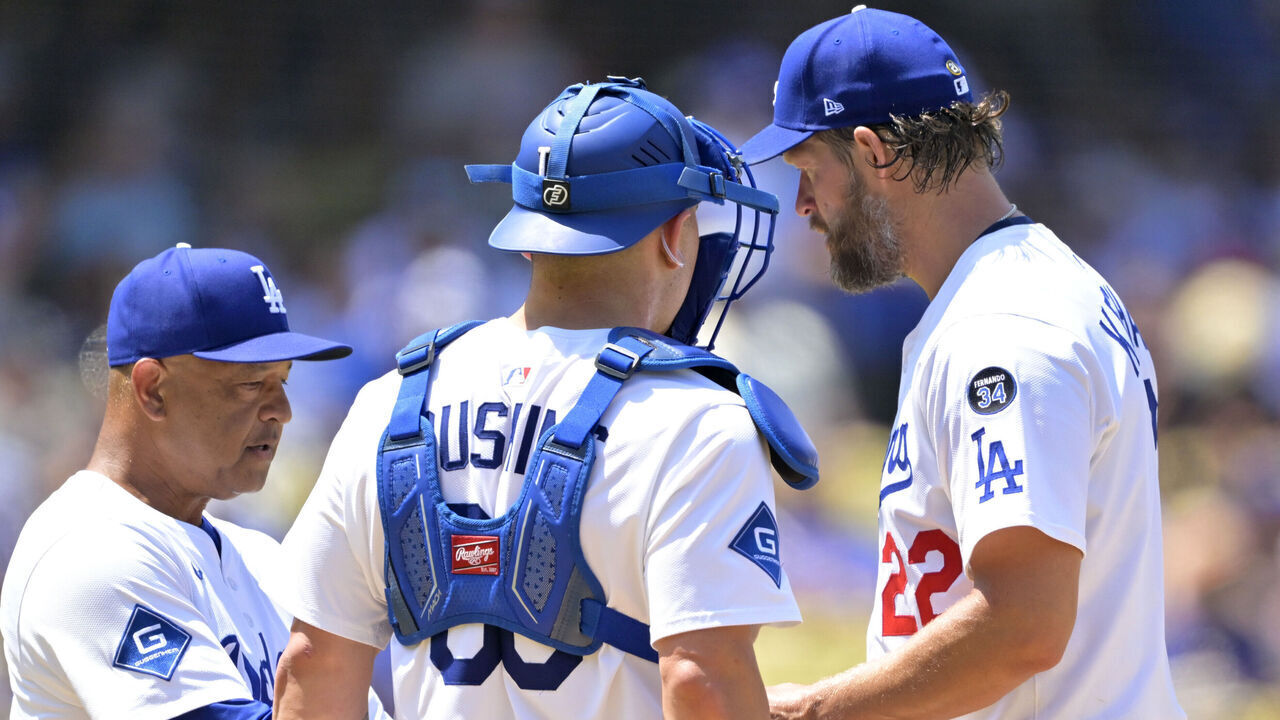 LOS ANGELES, CALIFORNIA - JULY 20: Dave Roberts #30 of the Los Angeles Dodgers pulls Clayton Kershaw #22 as Dalton Rushing #68 looks on in the fifth inning against the Milwaukee Brewers at Dodger Stadium on July 20, 2025 in Los Angeles, California.