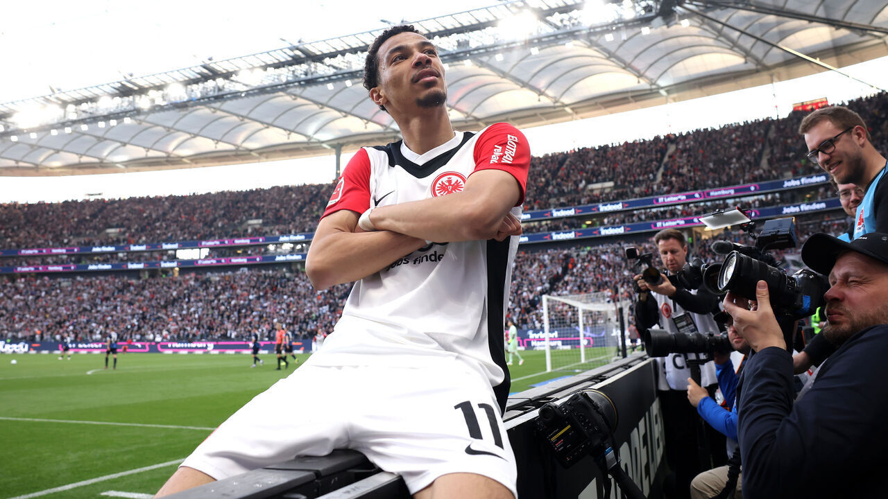 FRANKFURT AM MAIN, GERMANY - APRIL 13: Hugo Ekitike of Eintracht Frankfurt celebrates scoring his team's third goal during the Bundesliga match between Eintracht Frankfurt and 1. FC Heidenheim 1846 at Deutsche Bank Park on April 13, 2025 in Frankfurt am Main, Germany.