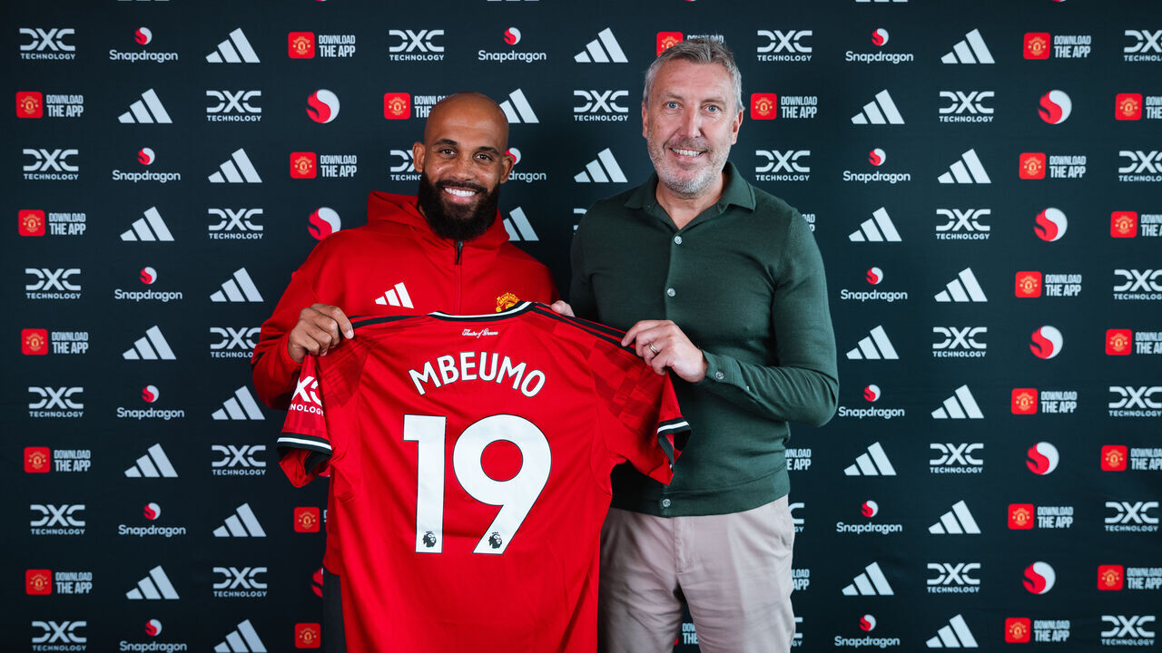 MANCHESTER, ENGLAND - JULY 20: (EXCLUSIVE COVERAGE) Bryan Mbeumo of Manchester United poses with Director of Football Jason Wilcox after signing for the club at Carrington Training Ground on July 21, 2025 in Manchester, England.