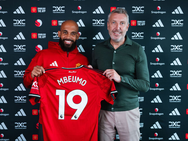 MANCHESTER, ENGLAND - JULY 20: (EXCLUSIVE COVERAGE) Bryan Mbeumo of Manchester United poses with Director of Football Jason Wilcox after signing for the club at Carrington Training Ground on July 21, 2025 in Manchester, England.