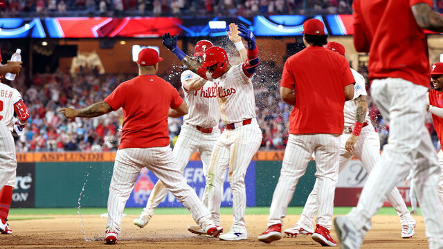 PHILADELPHIA, PENNSYLVANIA - JULY 21: Edmundo Sosa #33 of the Philadelphia Phillies celebrates with teammates after a catcher interference walk-off in the 10th inning against the Boston Red Sox during a game at Citizens Bank Park on July 21, 2025 in Philadelphia, Pennsylvania.