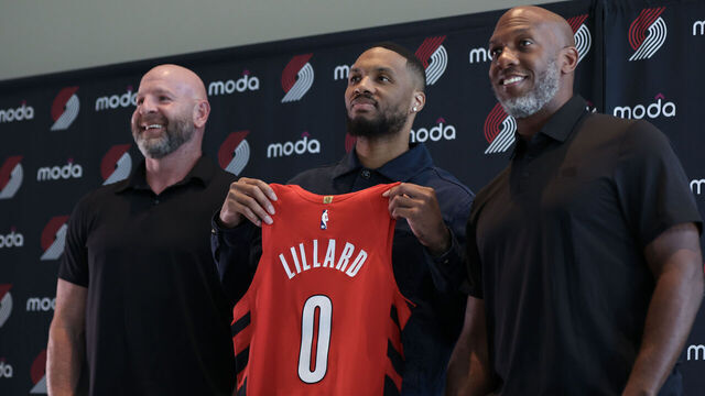 PORTLAND, OREGON - JULY 21: (L-R) General manager Joe Cronin, Damian Lillard and head coach Chauncey Billups pose for a photo during a press conference at Moda Center on July 21, 2025 in Portland, Oregon.
