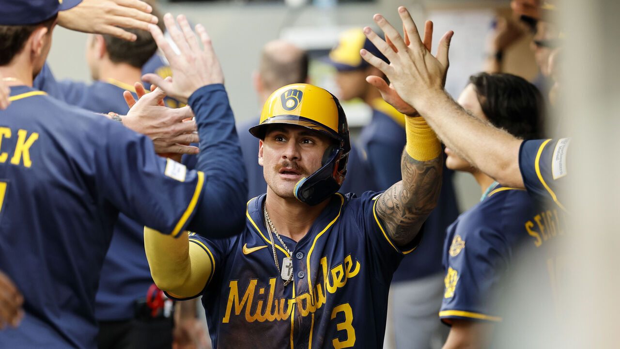 SEATTLE, WASHINGTON - JULY 21: Joey Ortiz #3 of the Milwaukee Brewers celebrates with teammates in the dugout after scoring off of William Contreras' (not pictured) sacrifice fly during the sixth inning against the Seattle Mariners at T-Mobile Park on July 21, 2025 in Seattle, Washington.
