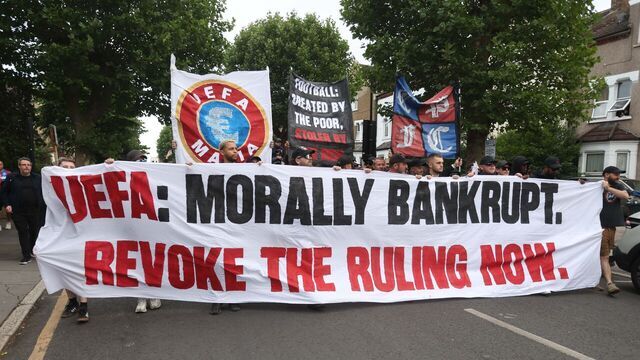 LONDON, ENGLAND - JULY 15: Fans of Crystal Palace hold banners outside Selhurst Park stadium as they protest against the UEFA decision to demote the club from Europa league to the Europa conference league after an alleged breach of the Multi Club Ownership rules from former Co Owner John Textor & Eagle Football Holdings co ownership of Crystal Palace FC & Olympique Lyonnais on July 15, 2025 in London, England.
