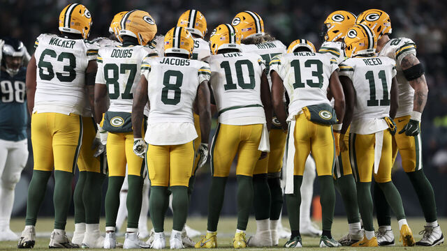 PHILADELPHIA, PENNSYLVANIA - JANUARY 12: The Green Bay Packers offense meets in the huddle during a Wild Card Playoff Game against the Philadelphia Eagles at Lincoln Financial Field on January 12, 2025 in Philadelphia, Pennsylvania. The Eagles defeated the Packers 22-10. (Kara Durrette/Getty Images)