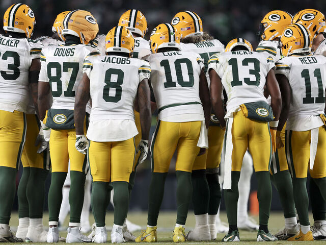 PHILADELPHIA, PENNSYLVANIA - JANUARY 12: The Green Bay Packers offense meets in the huddle during a Wild Card Playoff Game against the Philadelphia Eagles at Lincoln Financial Field on January 12, 2025 in Philadelphia, Pennsylvania. The Eagles defeated the Packers 22-10. (Kara Durrette/Getty Images)