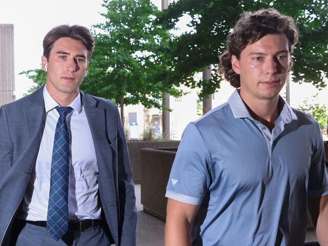 LONDON, CANADA - JULY 24: Michael McLeod, left, arrives at the London Courthouse, in London, Ontario, Canada on July 24, 2025. Former world junior hockey players Dillon Dubé, Cal Foote, Alex Formenton, Carter Hart and Michael McLeod, have all pleaded not guilty to a sexual assault that allegedly occurred at a London hotel in June 2018 as the team was celebrating their world championship win months earlier.