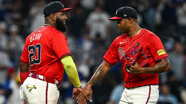 ATLANTA, GA SEPTEMBER 13: Atlanta designated hitter Marcell Ozuna (20) congratulates relief pitcher Raisel Iglesias (26) following the conclusion of the MLB game between the Los Angeles Dodgers and the Atlanta Braves on September 13th, 2024 at Truist Park in Atlanta, GA.