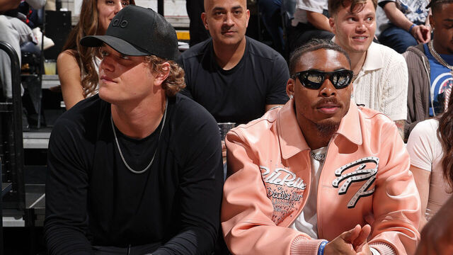 MINNEAPOLIS, MN - MAY 14: J.J. McCarthy and Justin Jefferson attend the game between the Golden State Warriors and the Minnesota Timberwolves during Round 2 Game 5 of the 2025 NBA Playoffs on May 14, 2025 at Target Center in Minneapolis, Minnesota. Mandatory Copyright Notice: Copyright 2025 NBAE