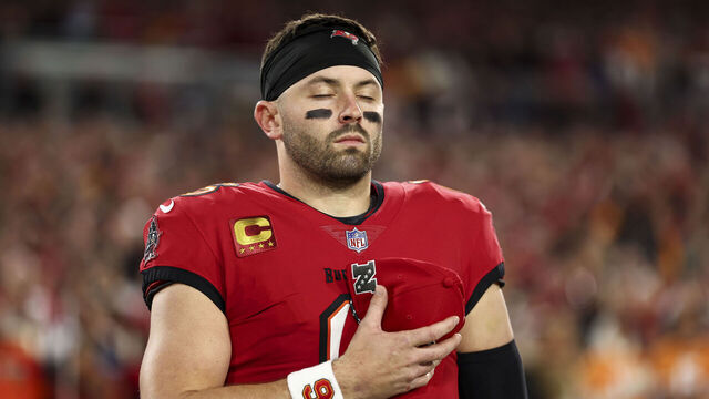 TAMPA, FLORIDA - JANUARY 12: Baker Mayfield #6 of the Tampa Bay Buccaneers stands on the sidelines during the national anthem prior to an NFL football wild card playoff game against the Washington Commanders at Raymond James Stadium on January 12, 2025 in Tampa, Florida.