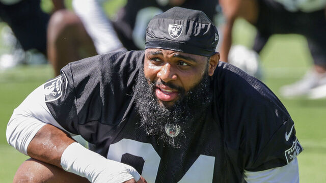 HENDERSON, NEVADA - MAY 29: Defensive tackle Christian Wilkins #94 of the Las Vegas Raiders stretches during an OTA offseason workout at the Las Vegas Raiders Headquarters/Intermountain Healthcare Performance Center on May 29, 2024 in Henderson, Nevada.