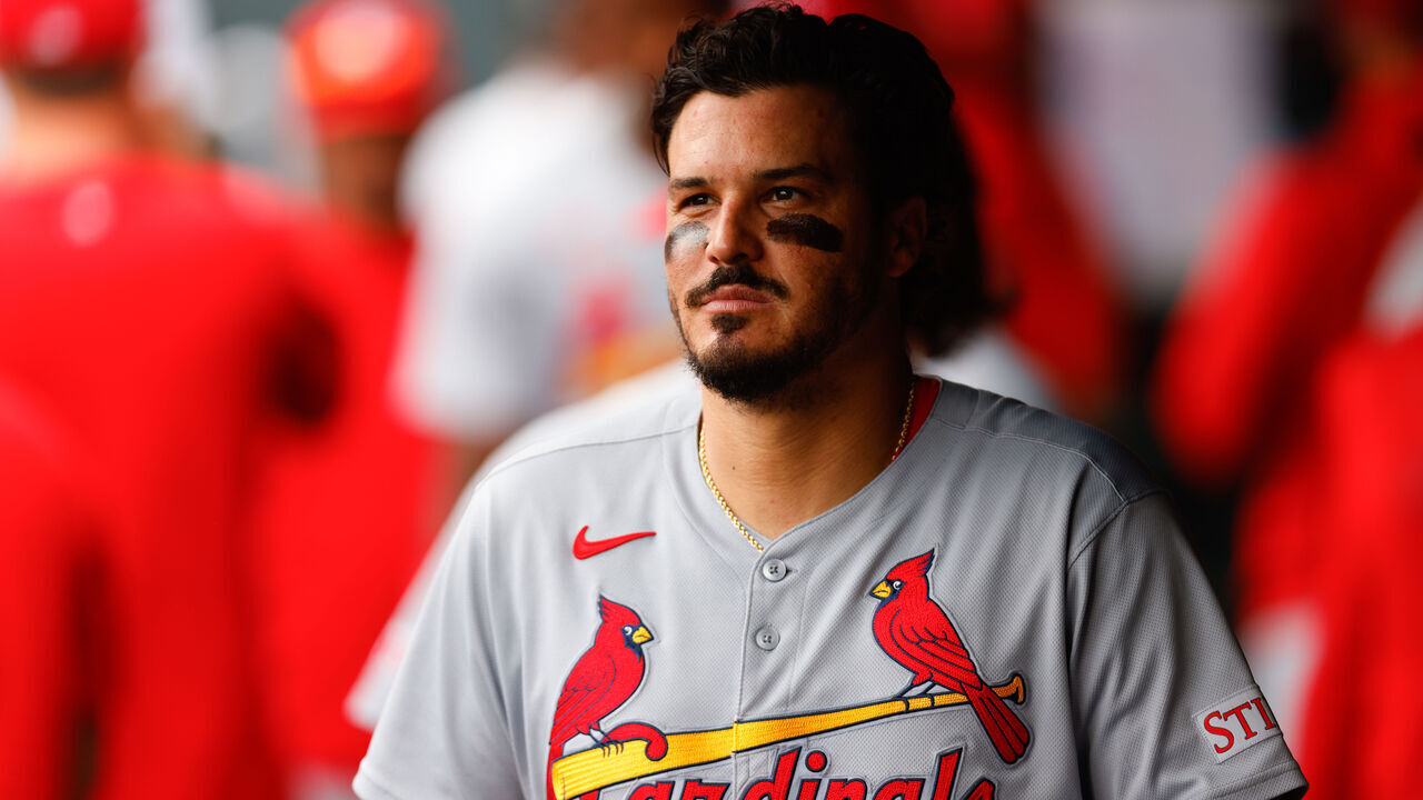 DENVER, CO - JULY 23: Nolan Arenado #28 of the St. Louis Cardinals walks in the dugout before taking the field in the second inning against the Colorado Rockies at Coors Field on July 23, 2025 in Denver, Colorado.