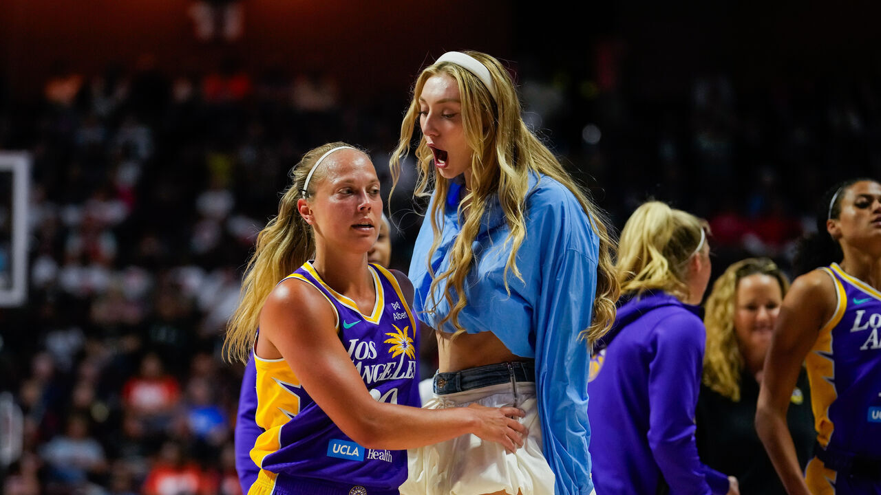 UNCASVILLE, CONNECTICUT - JULY 24: Cameron Brink #22 of the Los Angeles Sparks cheers on Julie Allemand #20 of the Los Angeles Sparks during the first half of a WNBA basketball game against the Connecticut Sun at Mohegan Sun Arena on July 24, 2025 in Uncasville, Connecticut.