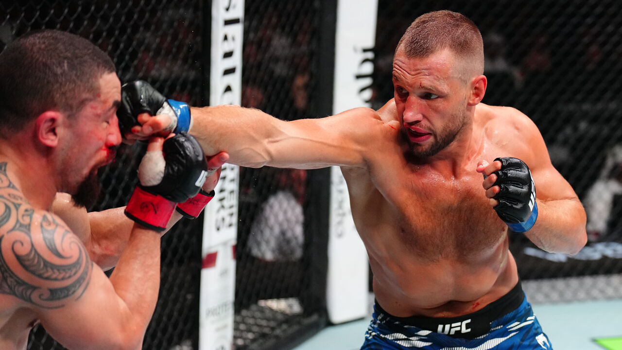 ABU DHABI, UNITED ARAB EMIRATES - JULY 26: (R-L) Reinier de Ridder of The Netherlands punches Robert Whittaker of New Zealand in a middleweight fight during the UFC Fight Night event at Etihad Arena on July 26, 2025 in Abu Dhabi, United Arab Emirates.