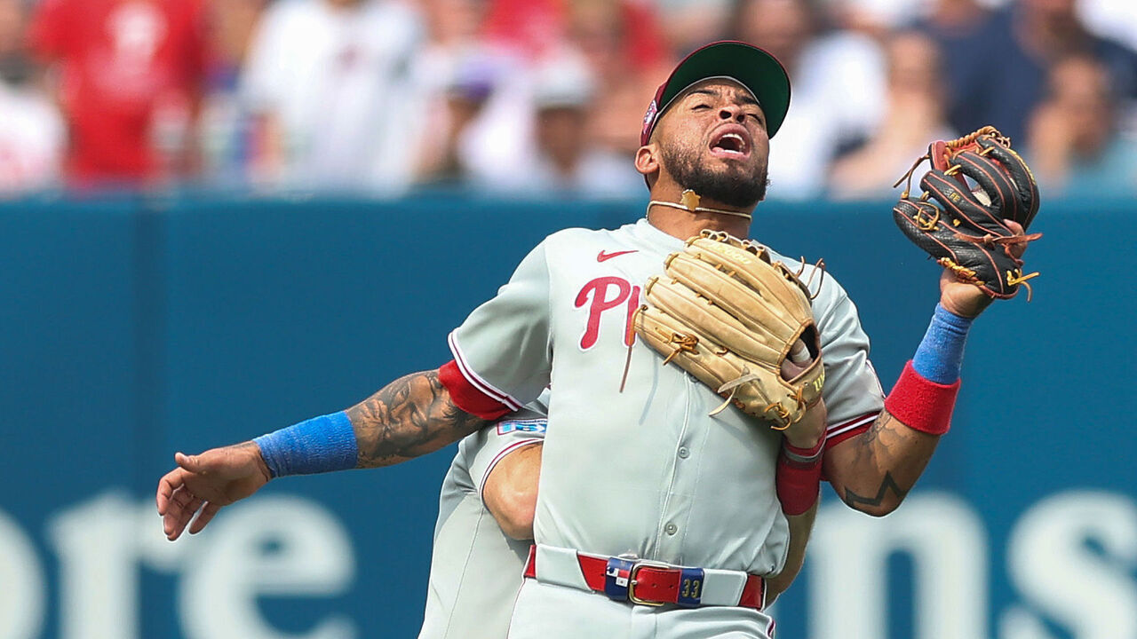 NEW YORK, NEW YORK - JULY 26: Brandon Marsh #16 of the Philadelphia Phillies runs into Edmundo Sosa #33 during the seventh inning against the New York Yankees at Yankee Stadium on July 26, 2025 in the Bronx borough of New York City.