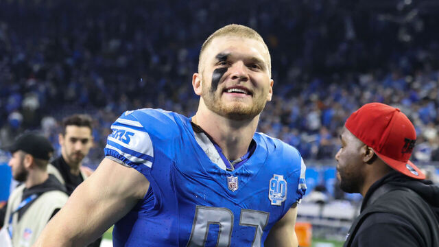 DETROIT, MI - JANUARY 14: Detroit Lions defensive end Aidan Hutchinson (97) smiles at fans as he runs off of the field at the conclusion of an NFL NFC Wild Card playoff football game between the Los Angeles Rams and the Detroit Lions on January 14, 2024 at Ford Field in Detroit, Michigan.