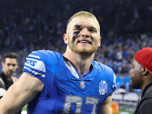 DETROIT, MI - JANUARY 14: Detroit Lions defensive end Aidan Hutchinson (97) smiles at fans as he runs off of the field at the conclusion of an NFL NFC Wild Card playoff football game between the Los Angeles Rams and the Detroit Lions on January 14, 2024 at Ford Field in Detroit, Michigan.