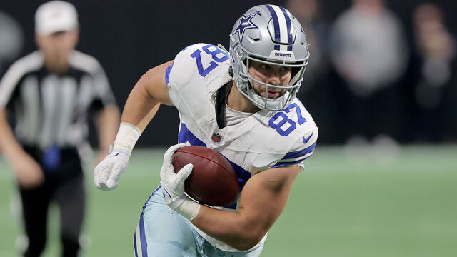 ATLANTA, GA - NOVEMBER 03: Dallas Cowboys tight end Jake Ferguson #87 carries the ball during the Sunday afternoon NFL game between the Atlanta Falcons and the Dallas Cowboys on November 3, 2024 at the Mercedes-Benz Stadium in Atlanta, Georgia.